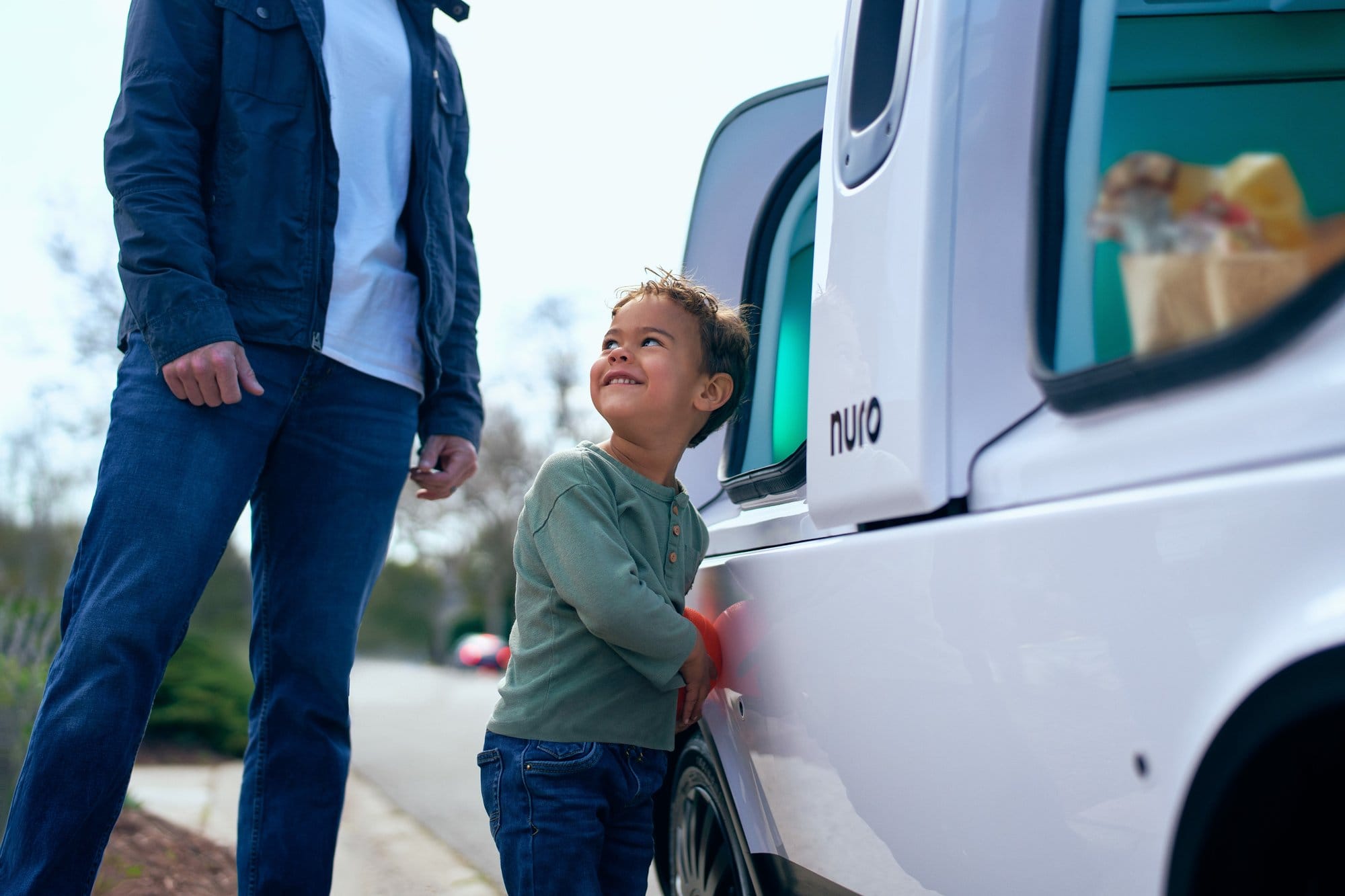 Parent and child retrieving groceries